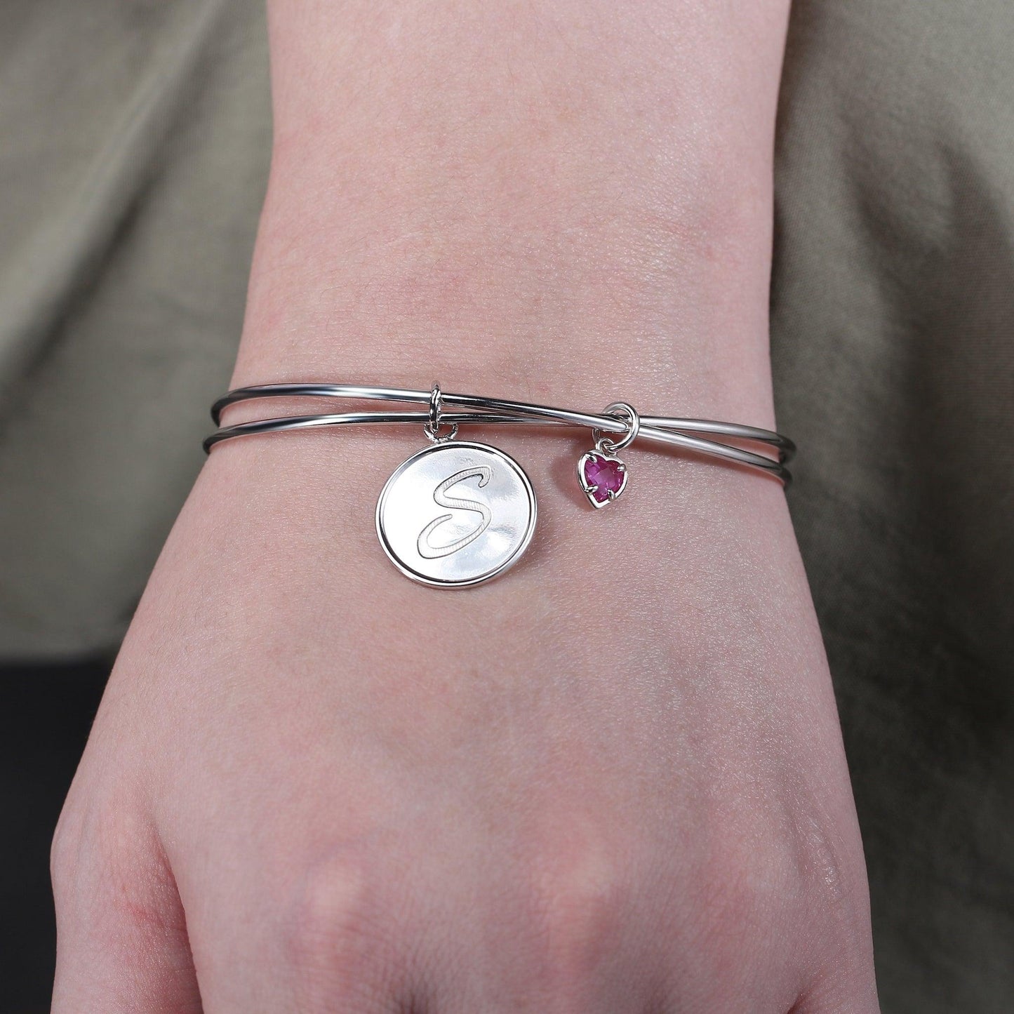 Infinity Initial Bracelet is crafted in sterling silver, include initial letter and birthstone charms.
