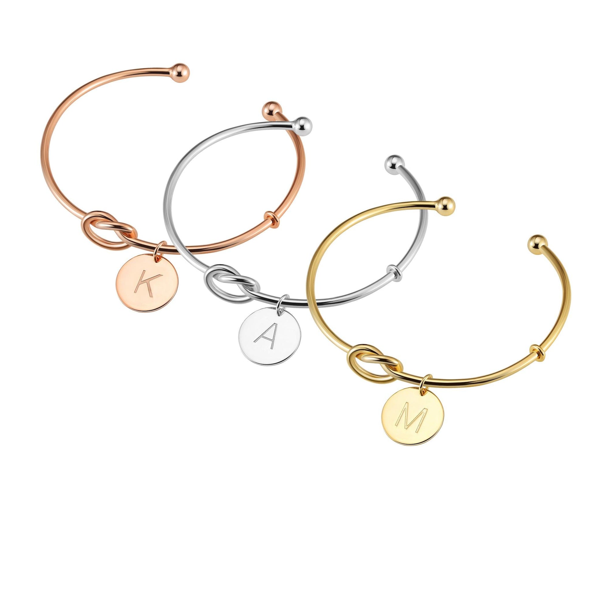 The Knot Initial Bracelet crafted in sterling silver is available in rose gold, gold and silver finishes and include an initial letter charm.