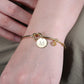 Knot Initial Bracelet in gold with one initial letter charm and one birthstone charm makes the perfect friendship bracelet.