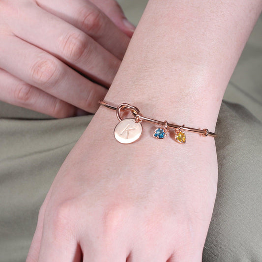 Knot Initial Bracelet in Rose Gold with two birthstone charms makes the perfect friendship gift.