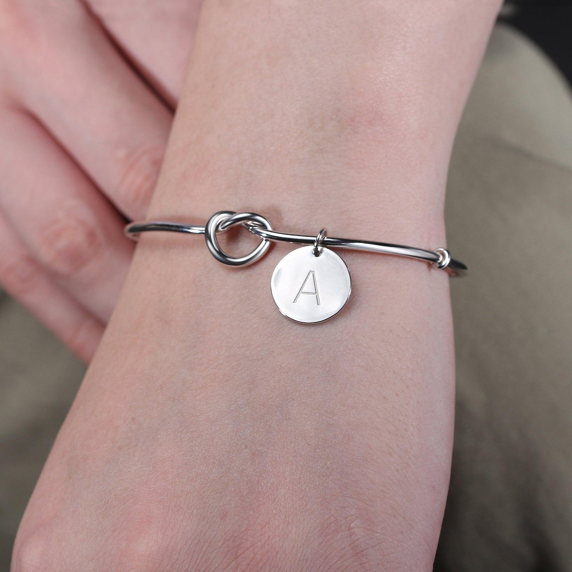 Knot Initial Bracelet in sterling silver includes an initial letter charm for added jewelry personalization.