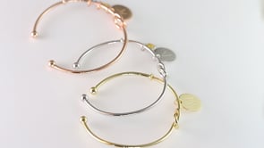 The Knot Initial Bracelet crafted in sterling silver is available in rose gold, gold and silver finishes and include an initial letter charm.